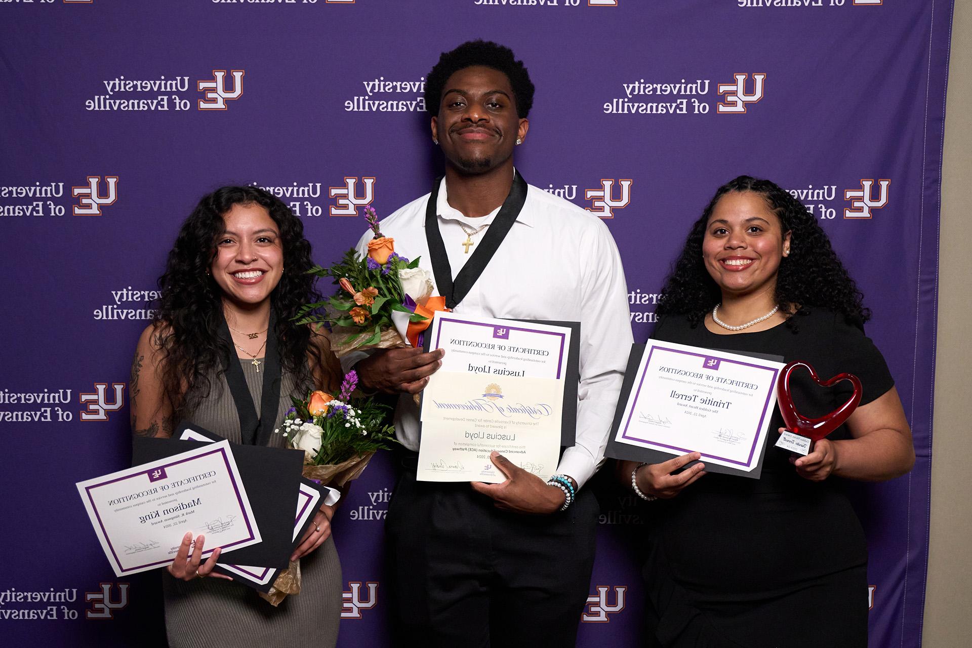 Students holding leadership awards